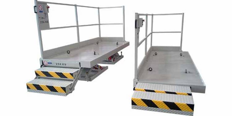 Tandem lift tables with moving stairs and handle in the stair area